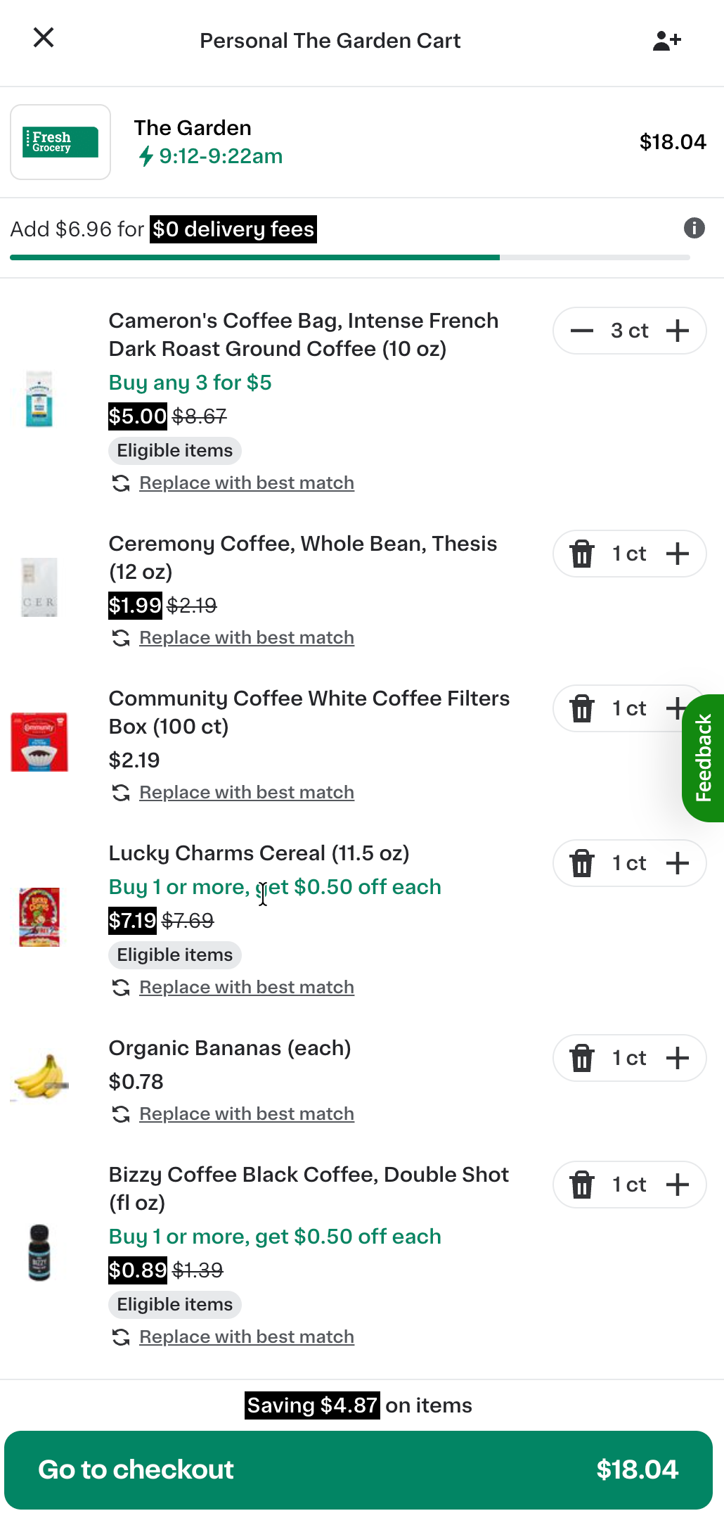 Shows an updated online cart for &quot;The Garden,&quot; with $6.96 remaining to unlock free delivery. Items include coffee, cereal, bananas, and a new addition, black coffee, with savings and adjustable item quantities listed at the bottom.