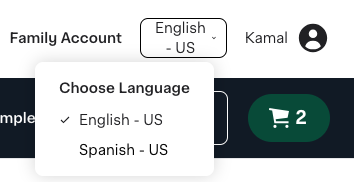 Shows a dropdown menu for choosing a language, with English - US selected and Spanish - US as an alternative. The interface also displays a cart icon with 2 items.