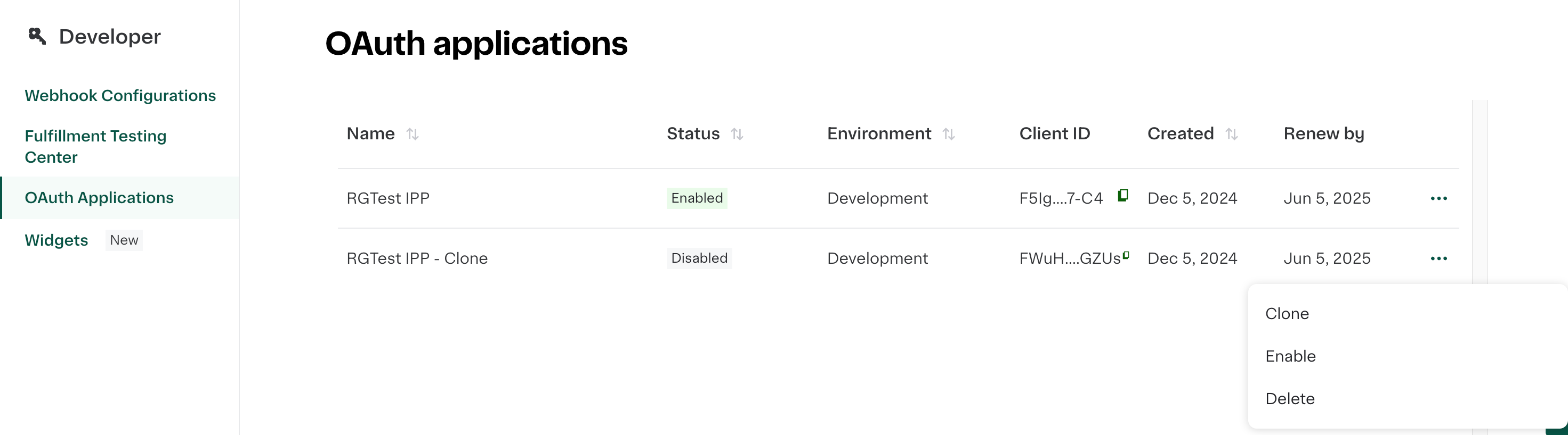 Shows OAuth applications list with two entries. &quot;RGTest IPP&quot; is enabled, and &quot;RGTest IPP - Clone&quot; is disabled. Dropdown menu shows options to clone, enable, or delete.