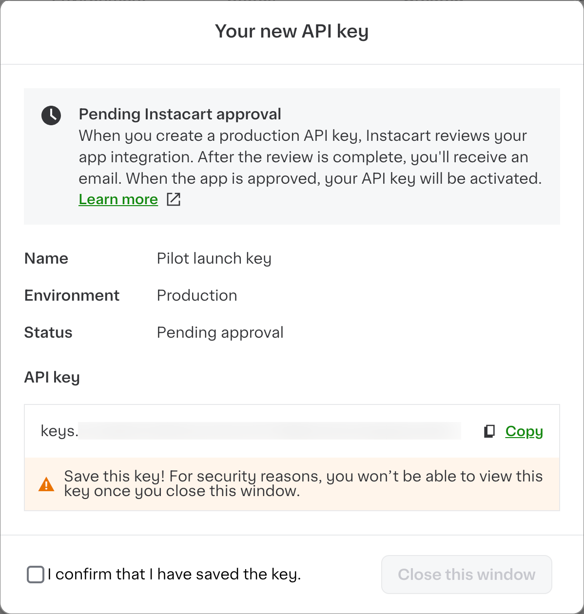 Shows the Your new API key dialog with the following message: Pending Instacart approval. When you create a production API key, Instacart reviews your app integration. After the review is complete, you&#39;ll receive an email. When the app is approved, your API key will be activated.